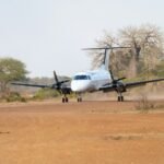 Light aircraft landing on a bush airstrip